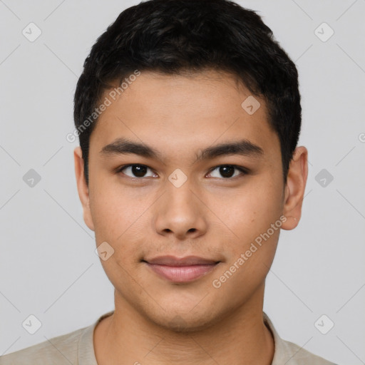 Joyful asian young-adult male with short  brown hair and brown eyes