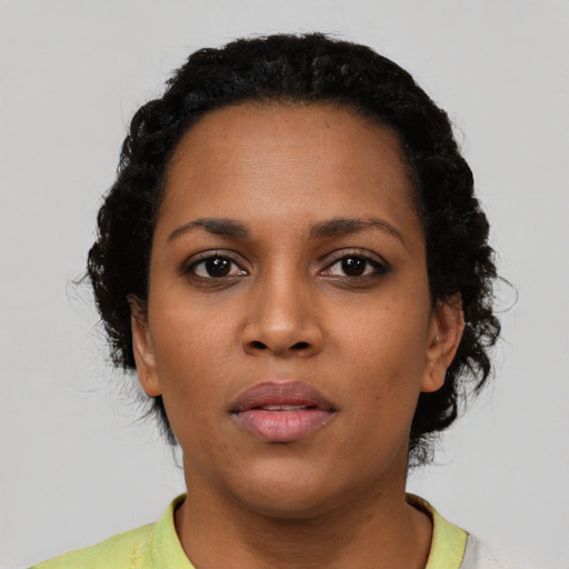 Neutral latino young-adult female with short  black hair and brown eyes