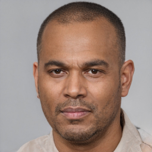 Neutral latino adult male with short  brown hair and brown eyes