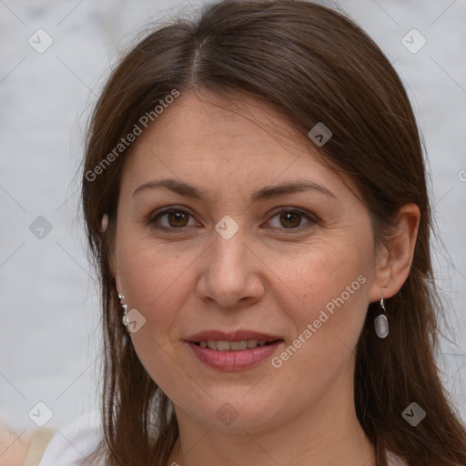 Joyful white adult female with medium  brown hair and brown eyes