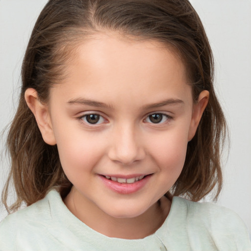 Joyful white child female with medium  brown hair and brown eyes