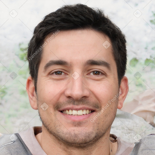 Joyful white young-adult male with short  black hair and brown eyes