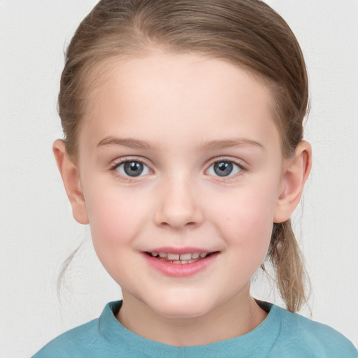 Joyful white child female with medium  brown hair and grey eyes