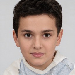 Joyful white child male with short  brown hair and brown eyes