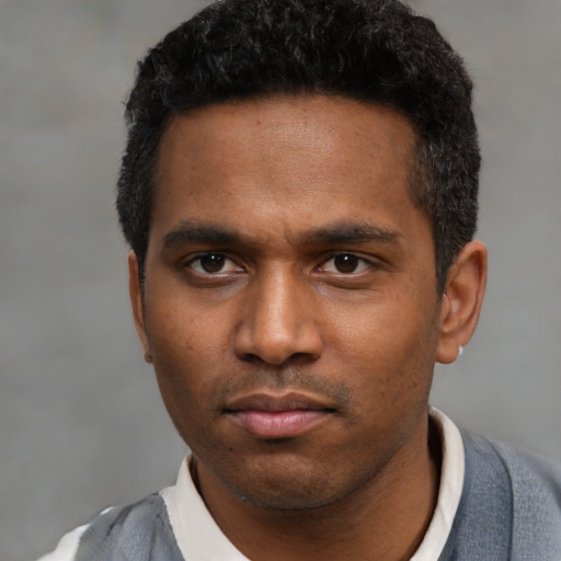 Neutral latino young-adult male with short  black hair and brown eyes