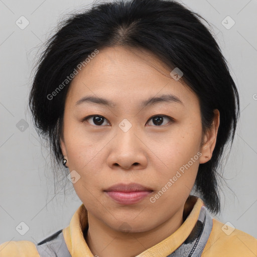 Joyful asian young-adult female with medium  brown hair and brown eyes