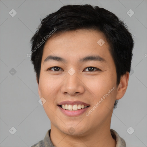 Joyful asian young-adult male with short  black hair and brown eyes