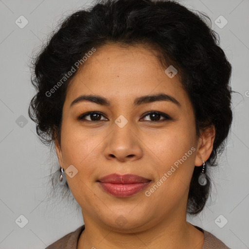 Joyful latino adult female with medium  brown hair and brown eyes