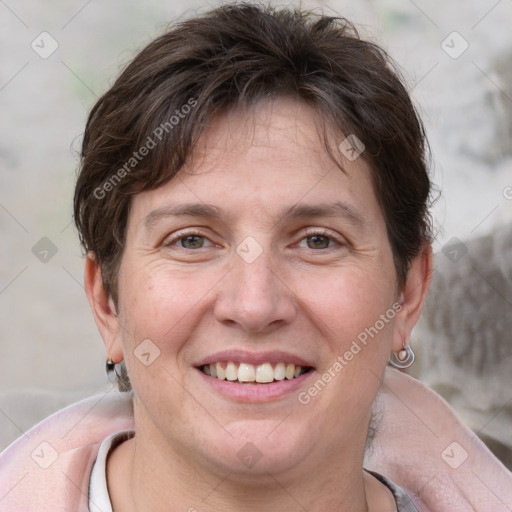 Joyful white adult female with short  brown hair and grey eyes