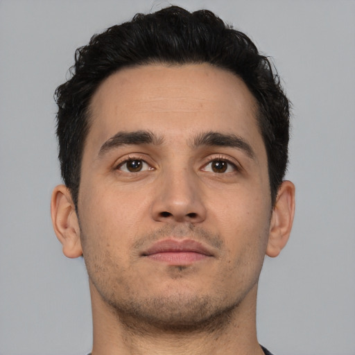 Neutral white young-adult male with short  black hair and brown eyes