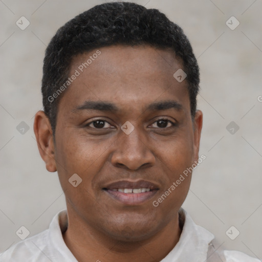 Joyful latino young-adult male with short  brown hair and brown eyes