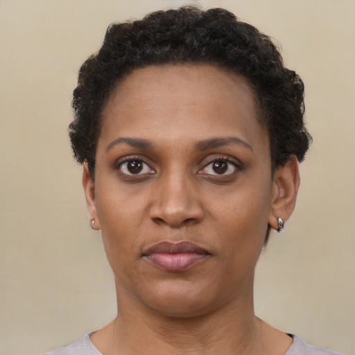 Neutral black young-adult female with short  black hair and brown eyes