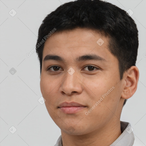 Joyful asian young-adult male with short  black hair and brown eyes