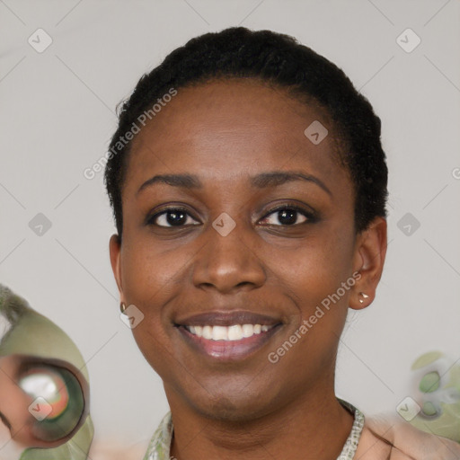 Joyful latino young-adult female with short  black hair and brown eyes