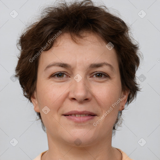 Joyful white adult female with short  brown hair and brown eyes