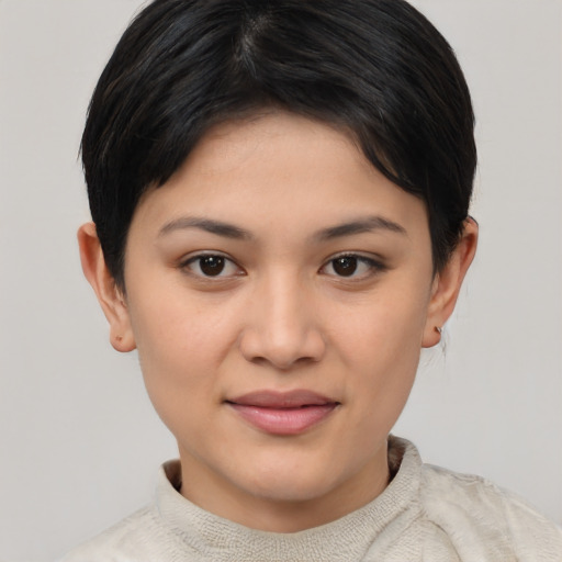 Joyful asian young-adult female with short  brown hair and brown eyes