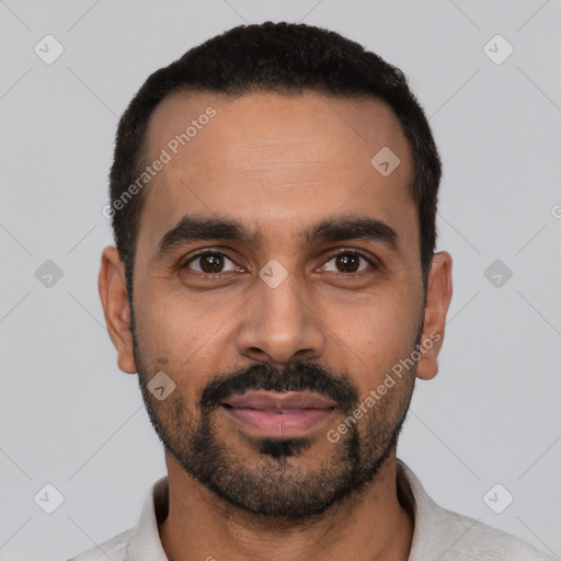 Joyful latino young-adult male with short  black hair and brown eyes