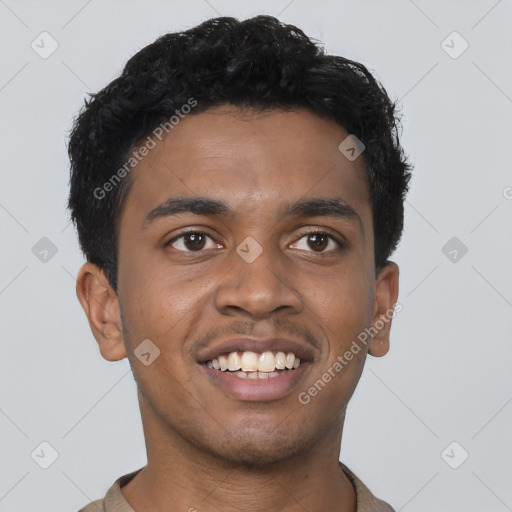 Joyful black young-adult male with short  brown hair and brown eyes