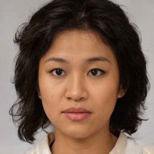 Neutral asian young-adult female with medium  brown hair and brown eyes
