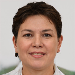 Joyful white adult female with short  brown hair and brown eyes