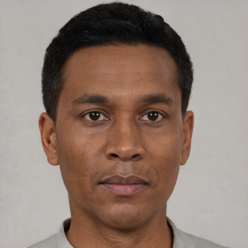 Neutral black young-adult male with short  black hair and brown eyes