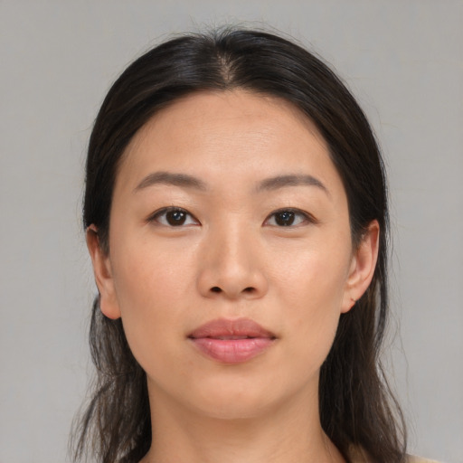 Joyful asian young-adult female with medium  brown hair and brown eyes