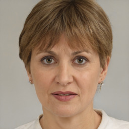 Joyful white adult female with short  brown hair and brown eyes