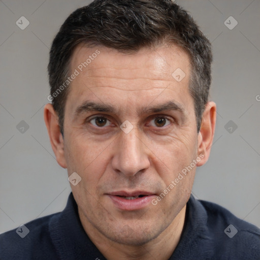 Joyful white adult male with short  brown hair and brown eyes