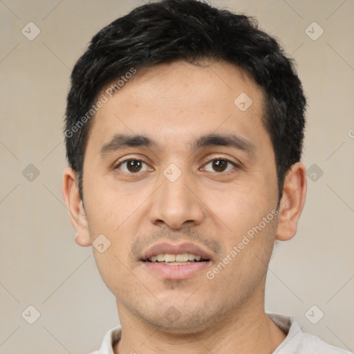 Joyful white young-adult male with short  black hair and brown eyes