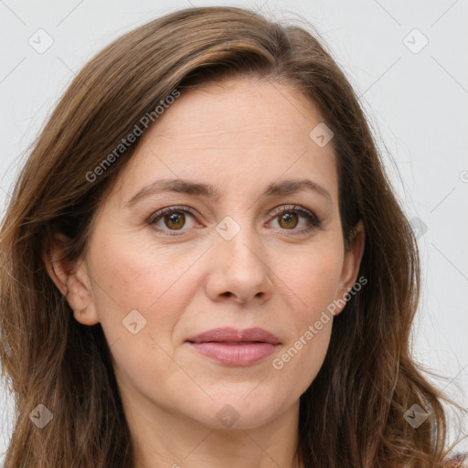 Joyful white adult female with long  brown hair and brown eyes