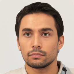 Neutral white young-adult male with short  black hair and brown eyes