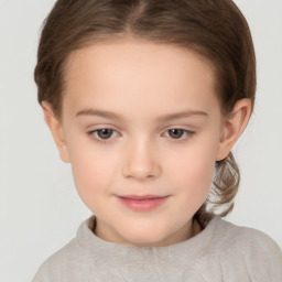 Joyful white child female with short  brown hair and brown eyes