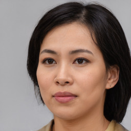 Neutral asian young-adult female with medium  brown hair and brown eyes