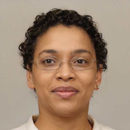 Joyful latino adult female with short  brown hair and brown eyes