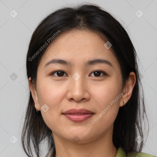 Joyful asian young-adult female with medium  brown hair and brown eyes