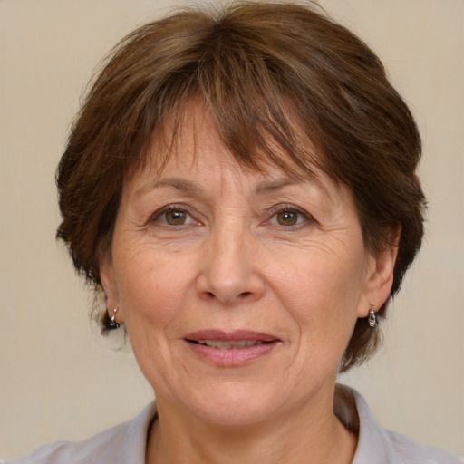 Joyful white middle-aged female with medium  brown hair and brown eyes