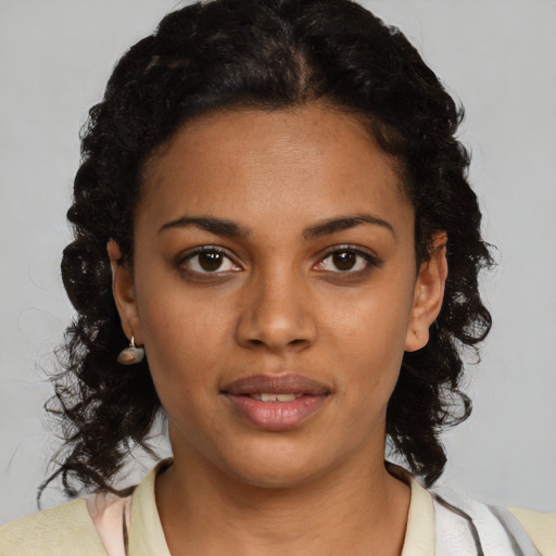 Neutral black young-adult female with medium  brown hair and brown eyes