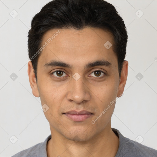 Joyful white young-adult male with short  black hair and brown eyes