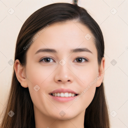 Joyful white young-adult female with long  black hair and brown eyes