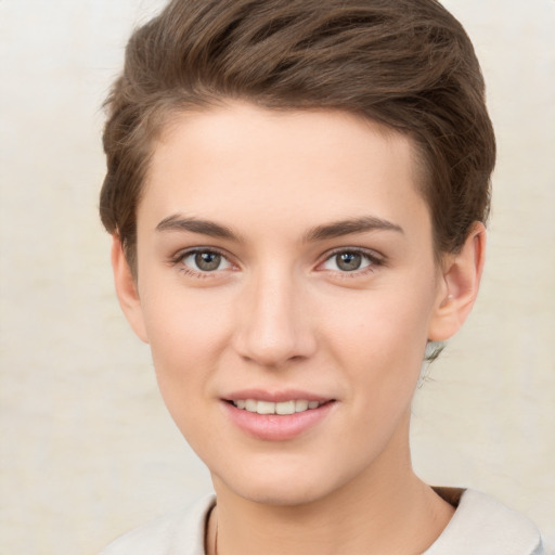 Joyful white young-adult female with short  brown hair and brown eyes