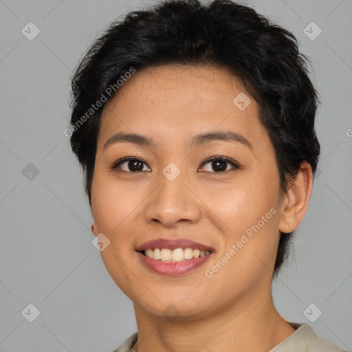 Joyful asian young-adult female with short  brown hair and brown eyes