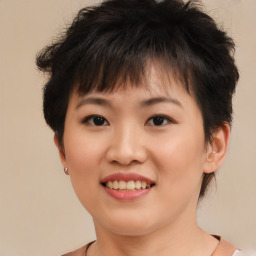 Joyful asian young-adult female with short  brown hair and brown eyes