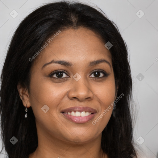 Joyful black young-adult female with long  brown hair and brown eyes