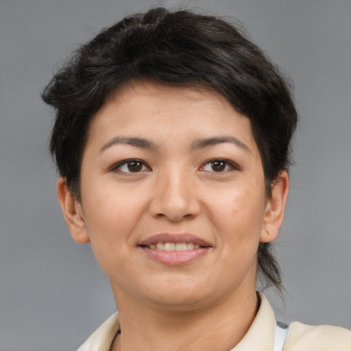 Joyful asian young-adult female with short  brown hair and brown eyes