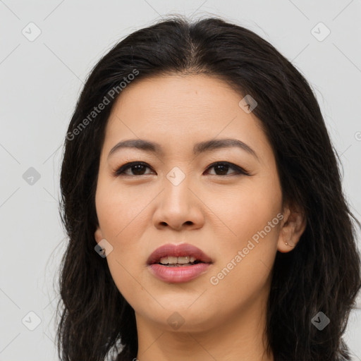 Joyful asian young-adult female with long  brown hair and brown eyes