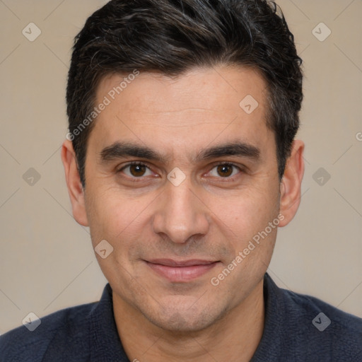 Joyful white adult male with short  brown hair and brown eyes