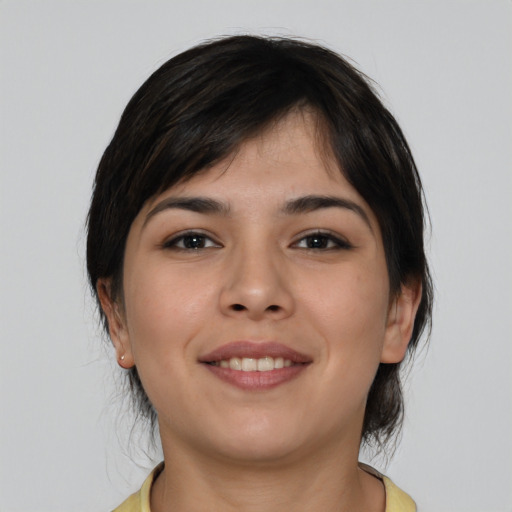 Joyful asian young-adult female with medium  brown hair and brown eyes