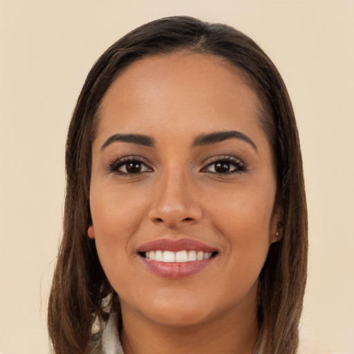 Joyful white young-adult female with long  brown hair and brown eyes