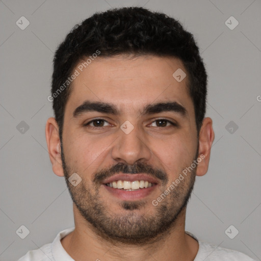 Joyful white young-adult male with short  black hair and brown eyes