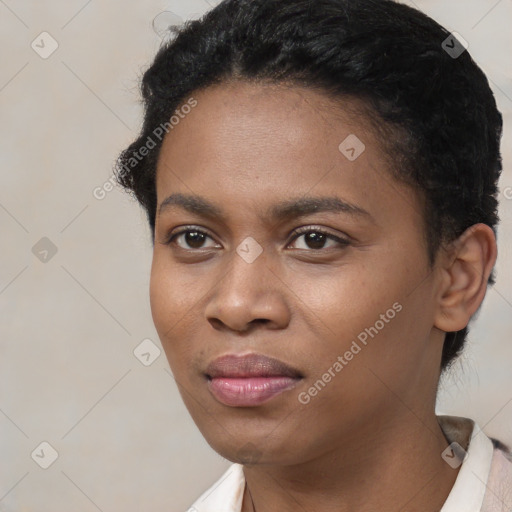 Joyful black young-adult female with short  black hair and brown eyes